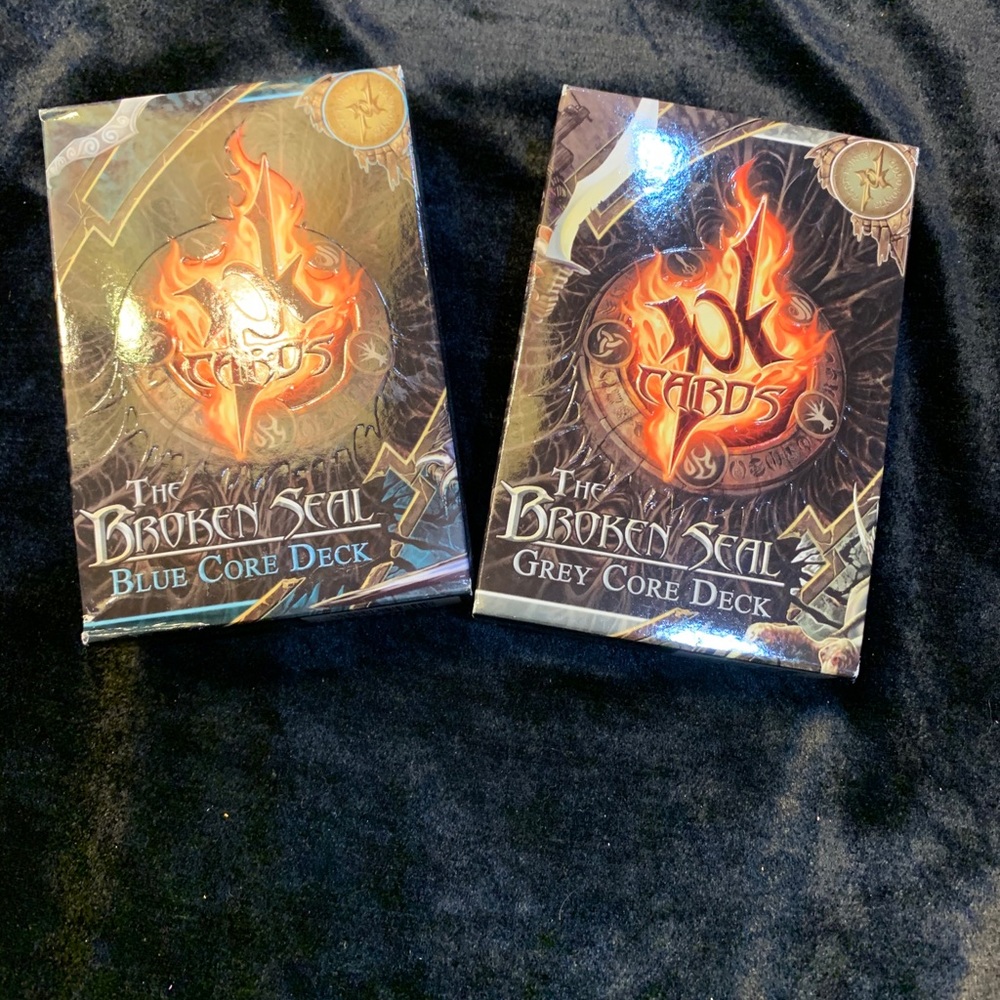 2 boxes of THE BROKEN SEAL game cards. NH3